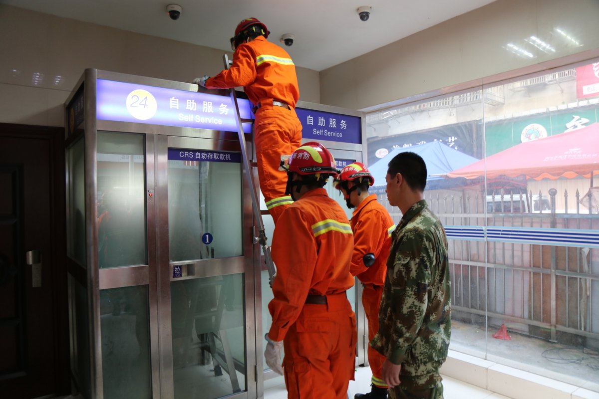 Two women need ladder to get out after getting stuck inside ATM cabin