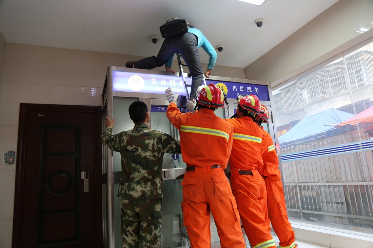 Two women need ladder to get out after getting stuck inside ATM cabin