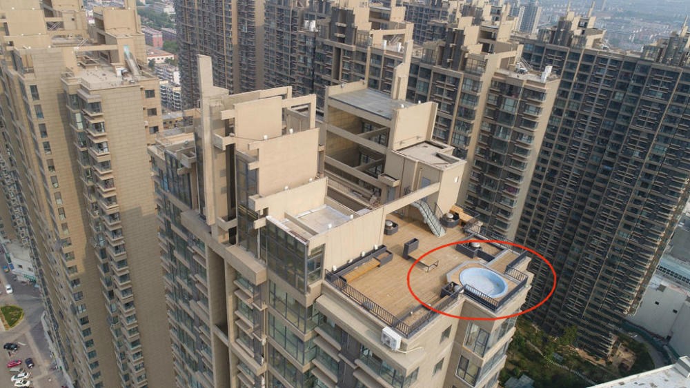 Owner told to demolish illegally built swimming pool on top of residential building