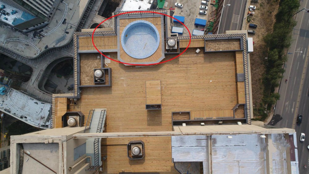 Owner told to demolish illegally built swimming pool on top of residential building