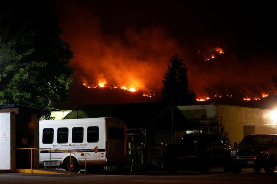 Thousands evacuated central California, wildfires burn across US West