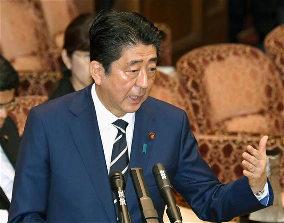 Lawmakers accuse Japan's Abe of false testimony in scandal