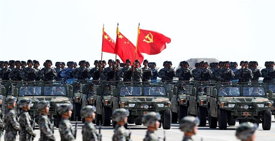 Xi reviews parade in field for first time