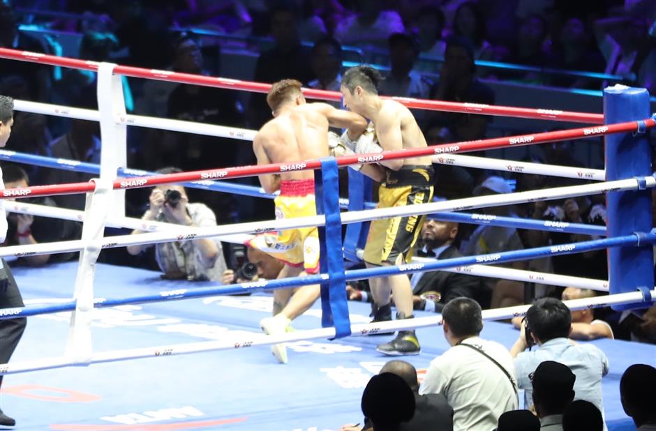 Beaten Zou vows to win back world title