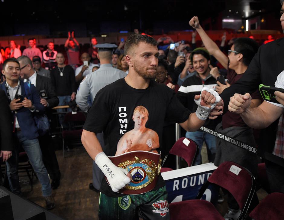 Lomachenko defends belt, stops Marriaga after 7 rounds