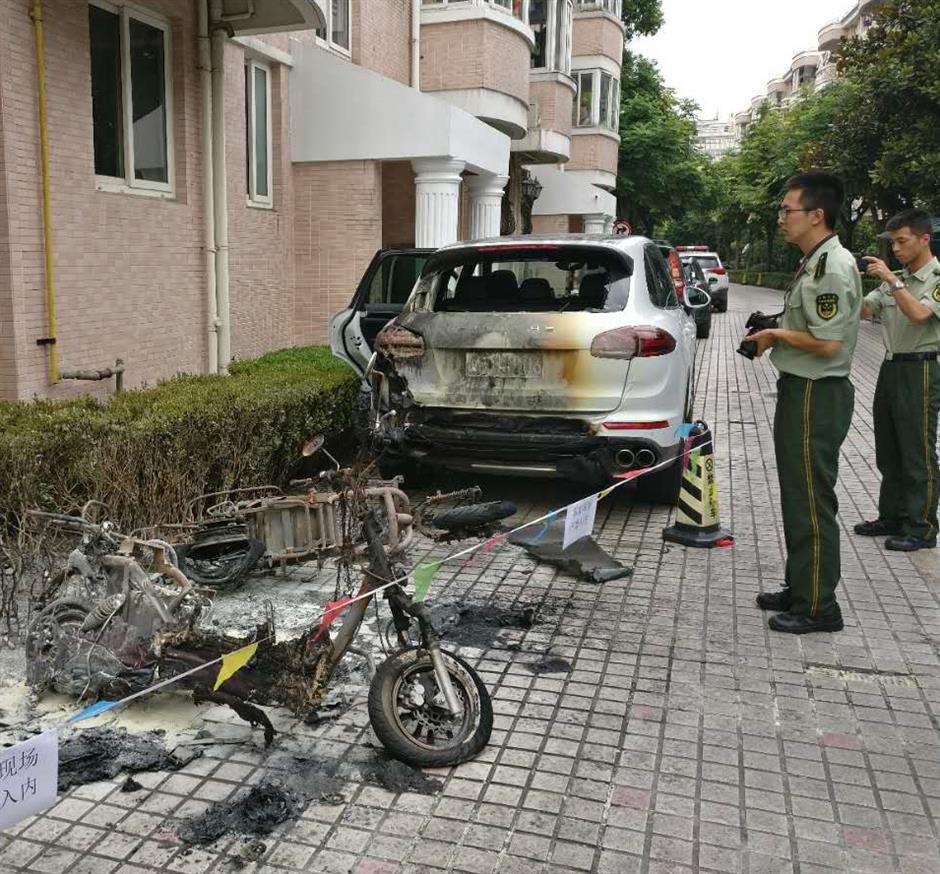 Vehicles damaged by fire in Jing'an