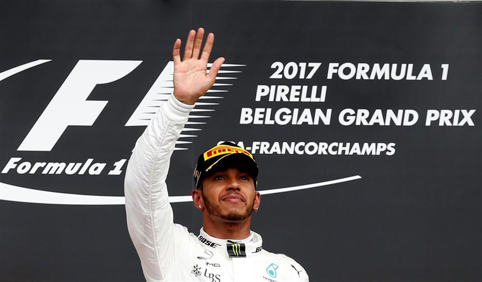 Hamilton marks 200th race with Spa success