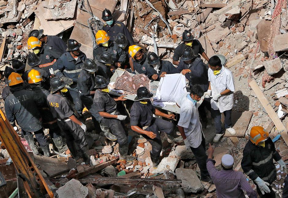 At least 21 die in collapsed building in Mumbai