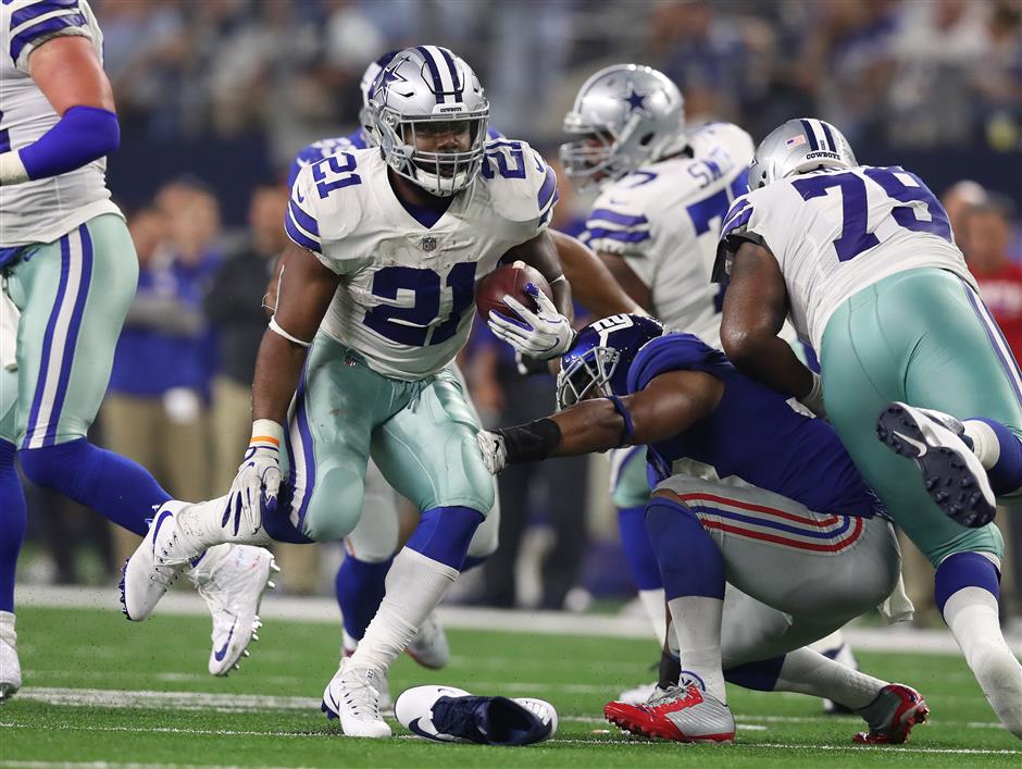 Cowboys' Elliott shines on the field despite threat of suspension