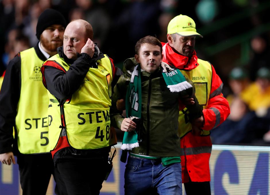 Celtic charged by UEFA over pitch invasion