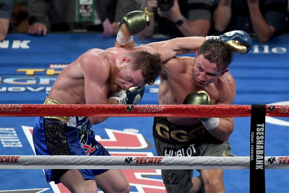 Golovkin, Alvarez fight to a brutal draw; rematch to come