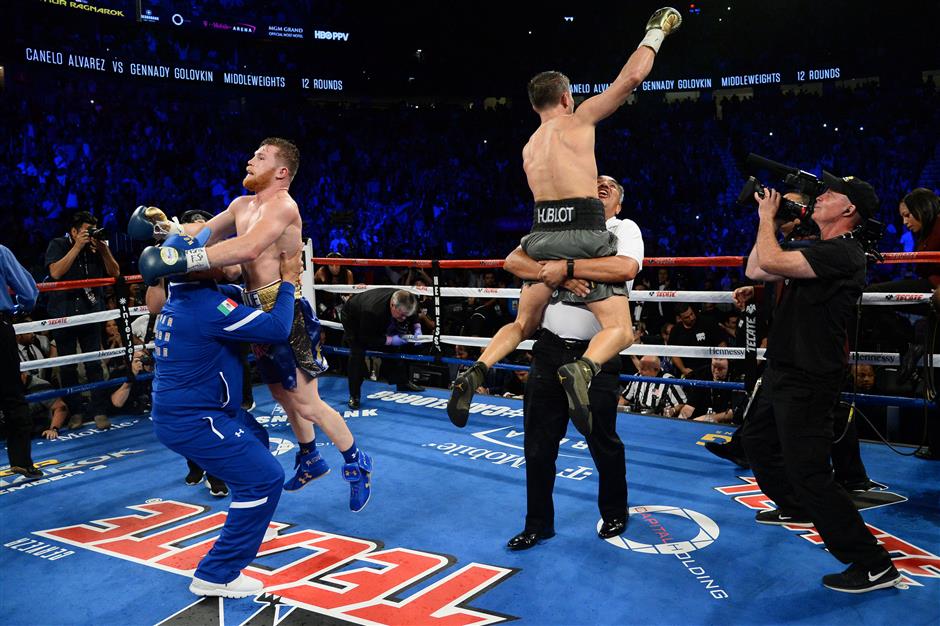 Golovkin, Alvarez fight to a brutal draw; rematch to come