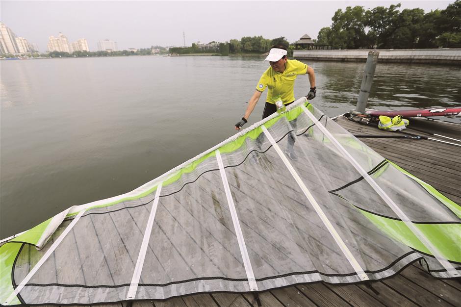 Retiree swaps the workplace to become a windsurfing beach boy