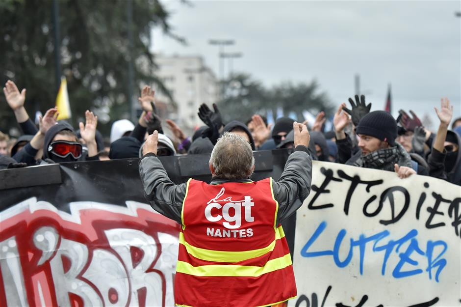 Striking French workers disrupt flights and schools