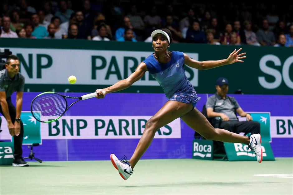 Venus stuns Muguruza to make last four at WTA Finals in Singapore