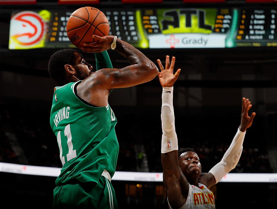 Irving stars as Celtics roll on, Warriors chill Heat