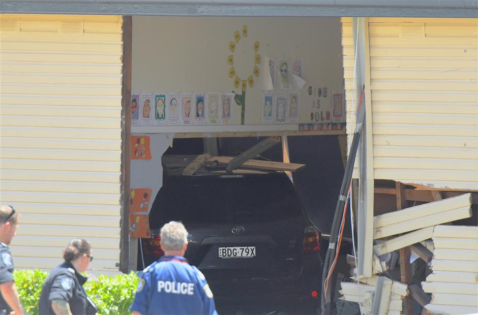 2 boys die after car plows into school