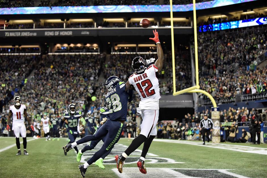 Ryan's 2 TD passes enough as Falcons hold off Seahawks 34-31