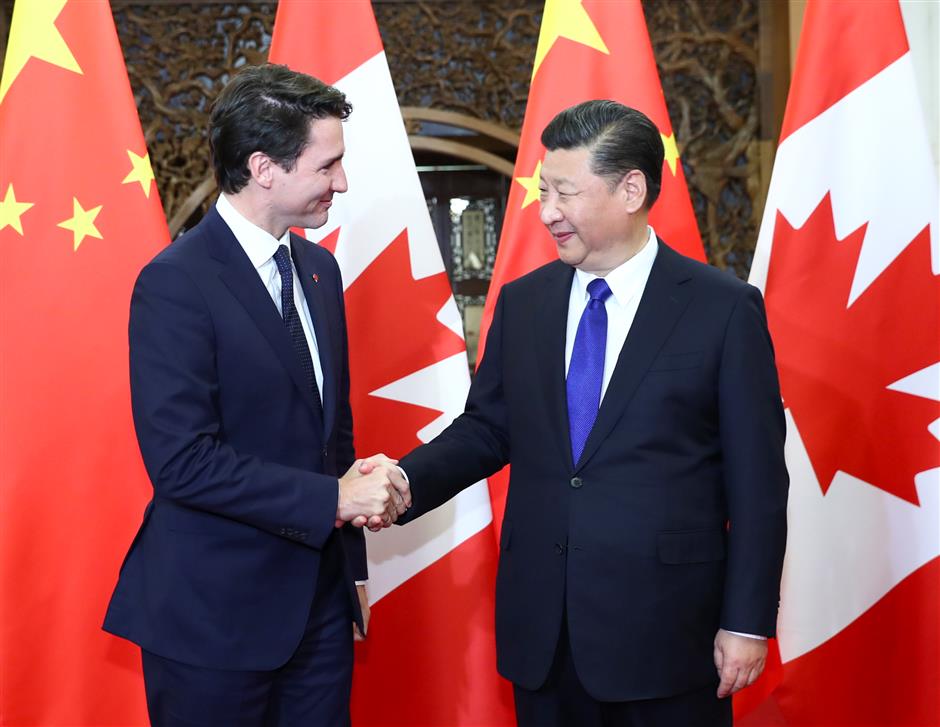 Xi meets Trudeau and urges measures to progress ties