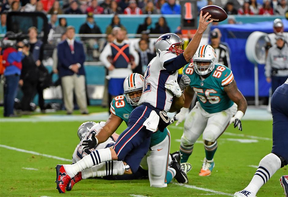 Brady intercepted twice as Dolphins stun Pats