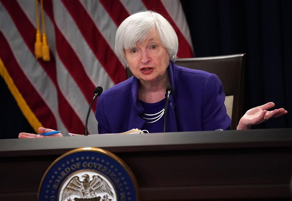 US Fed raises interest rate, forecasts 3 hikes in 2018