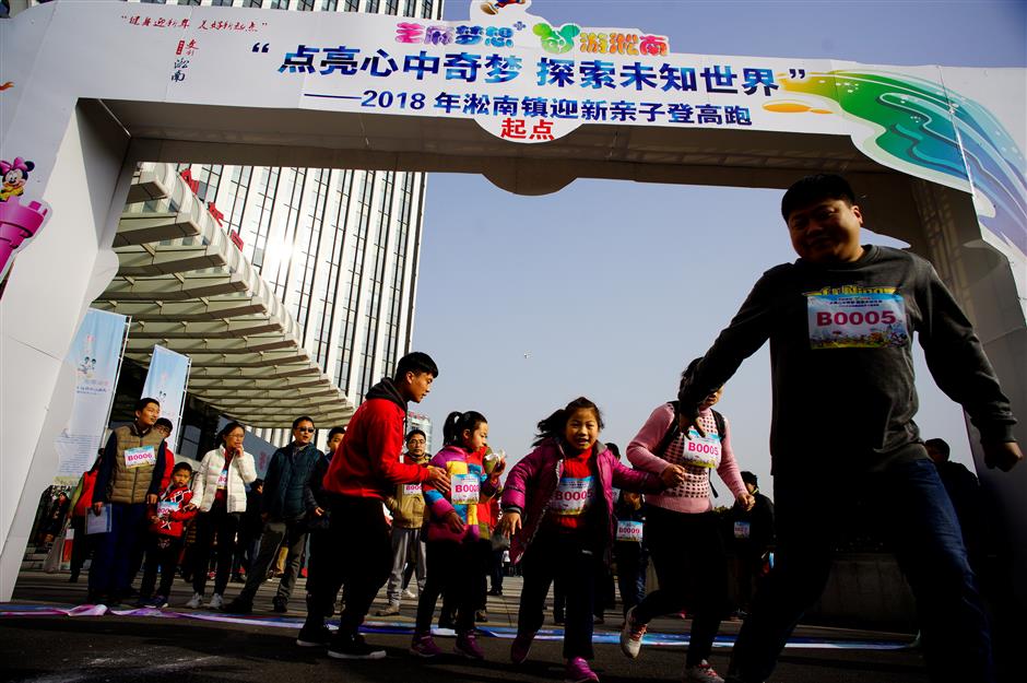 Locals climb buildings for a prosperous new year