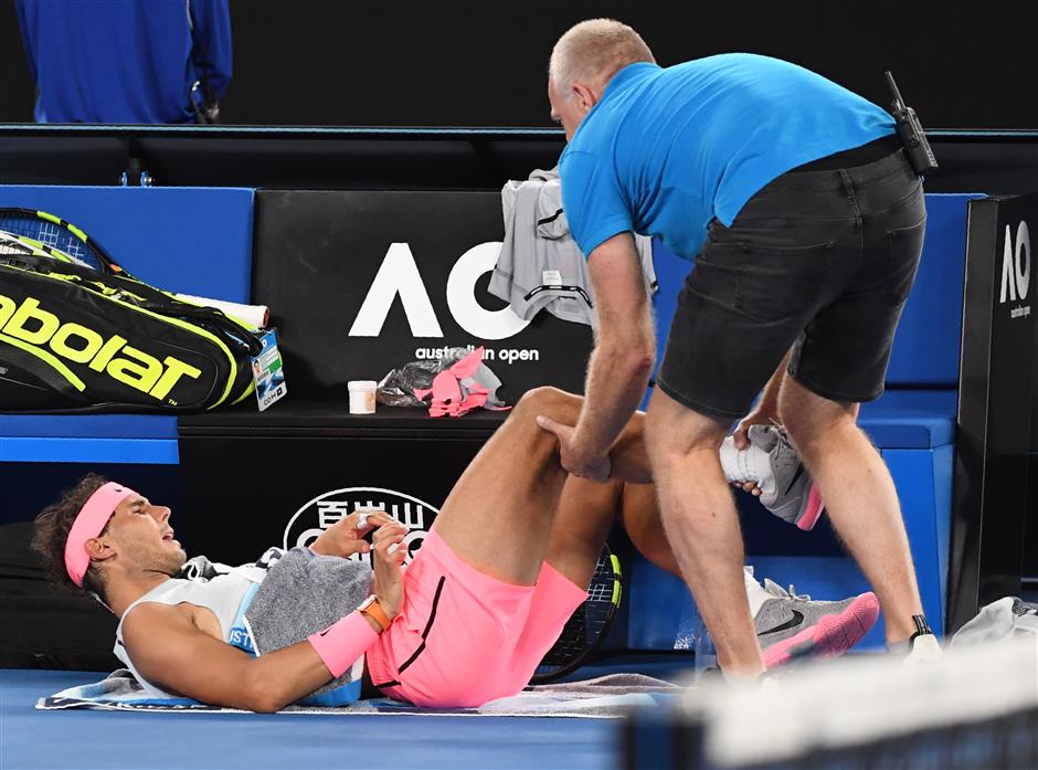 Nadal retires hurt, unseeded Edmund and Mertens advance