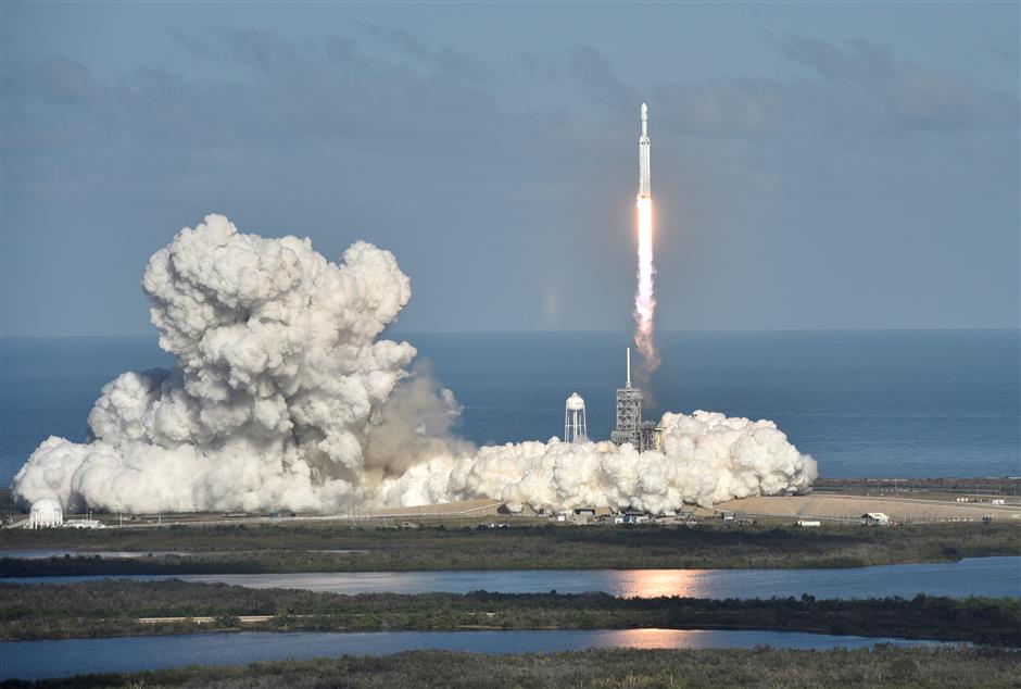 SpaceX's Falcon Heavy rocket soars in debut test launch from Florida