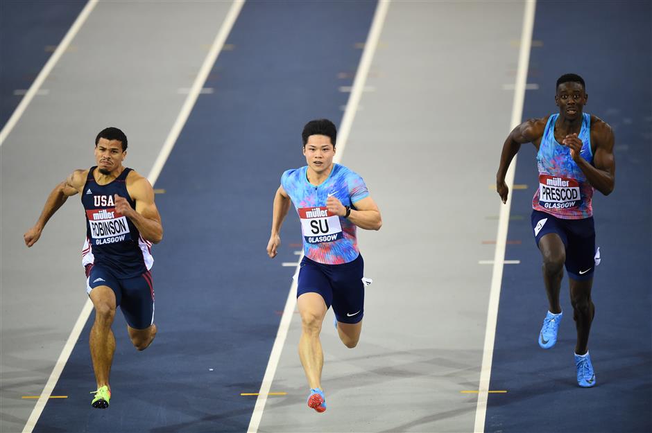 China's Su Bingtian wins his heat in the men's 60 meters in Glasgow