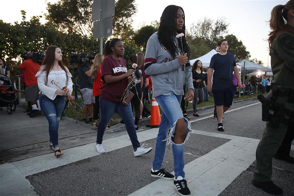 Students in emotional return to shooting-hit high school