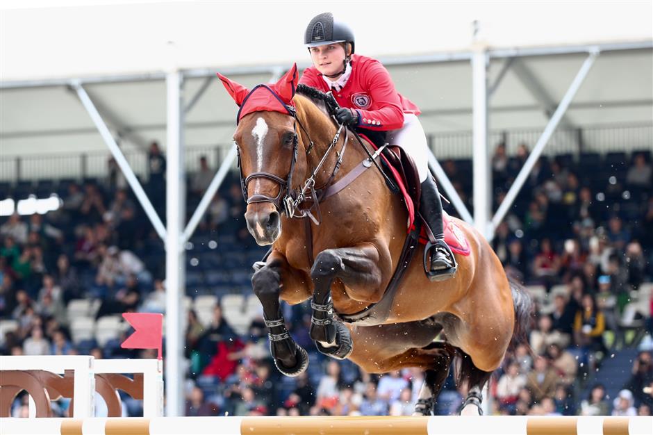 Riders gallop into the second day of show jumping competition