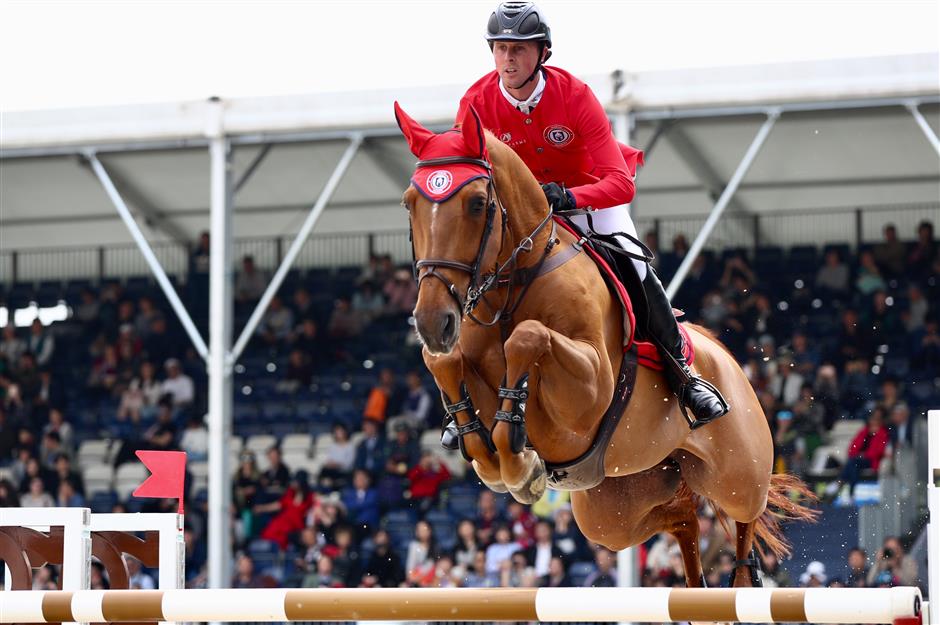 Riders gallop into the second day of show jumping competition