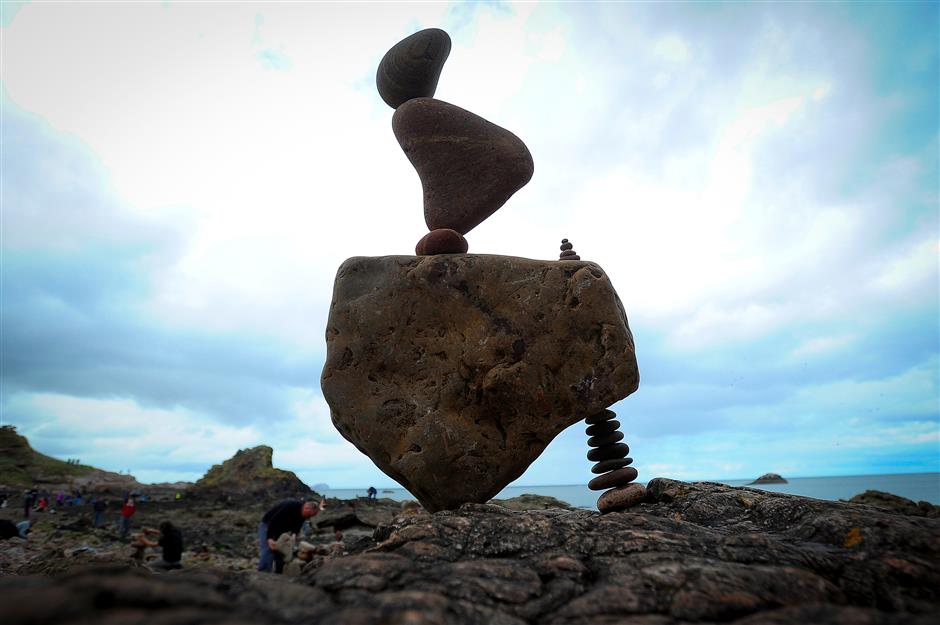 Stone stacking contest brings gravity-defying sculptures to Scottish beach