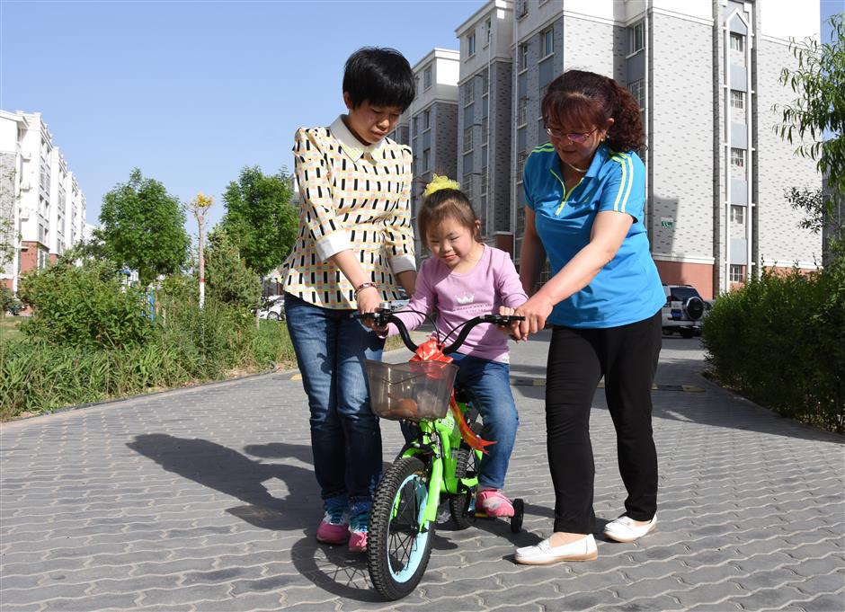 Orphaned kids bask in love of foster moms