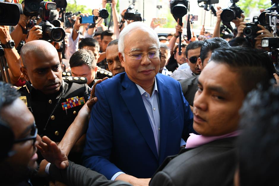 Former Malaysian PM Najib arrives at anti-corruption agency for questioning