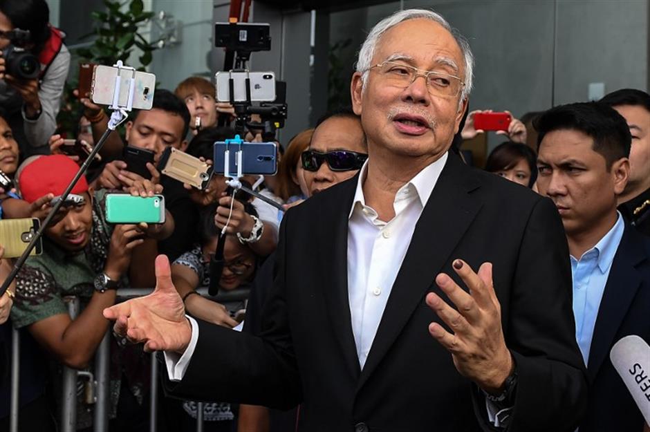 Large amounts of cash seized from apartments linked to former Malaysian PM Najib: police