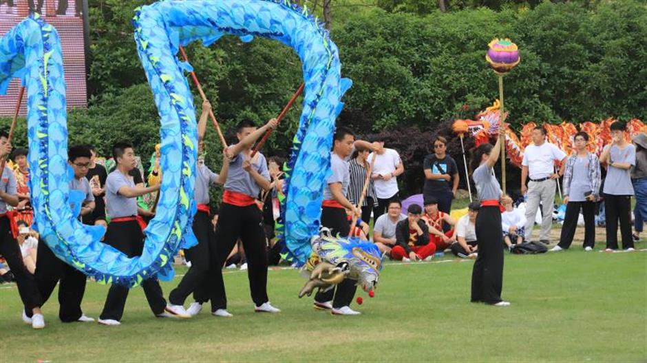 Dragon boat racing along  a deep current of heritage