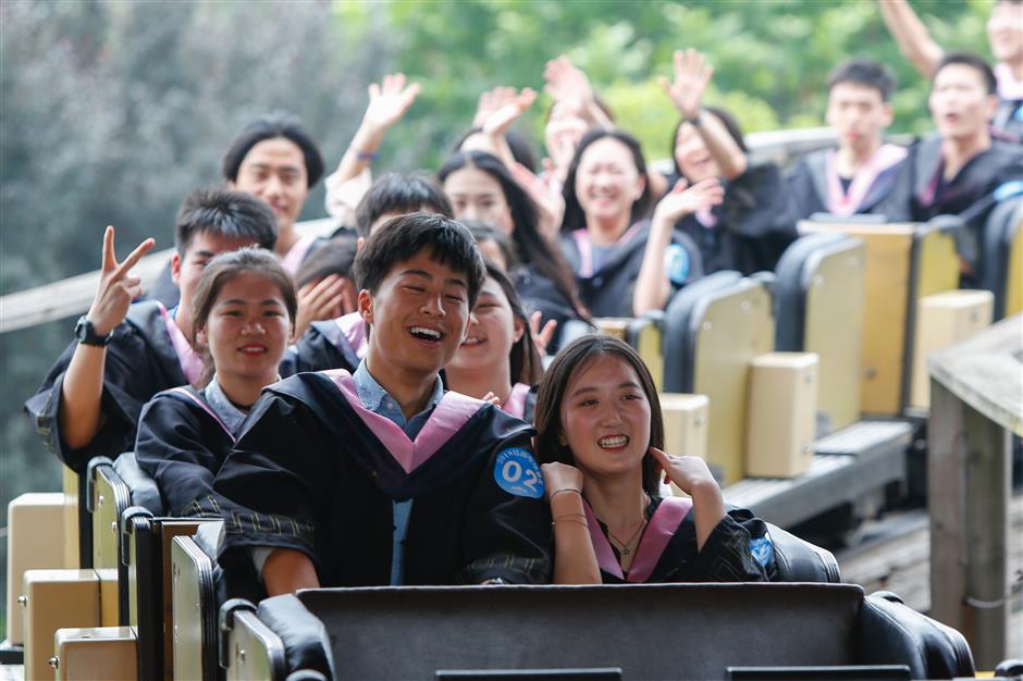 Students fly high in roller coaster graduation ceremony