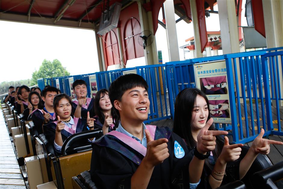 Students fly high in roller coaster graduation ceremony