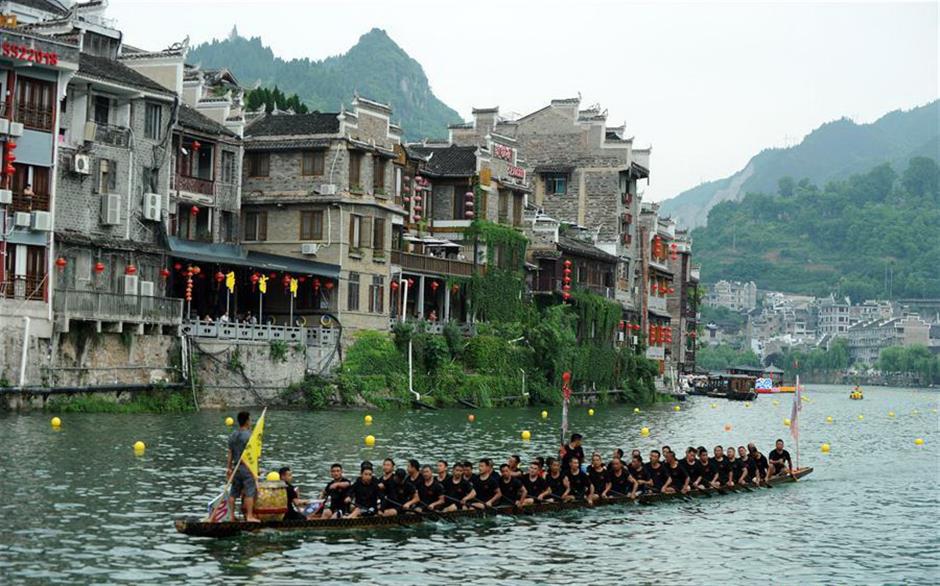 Training for dragon boat race held on Wuyang River in SW China