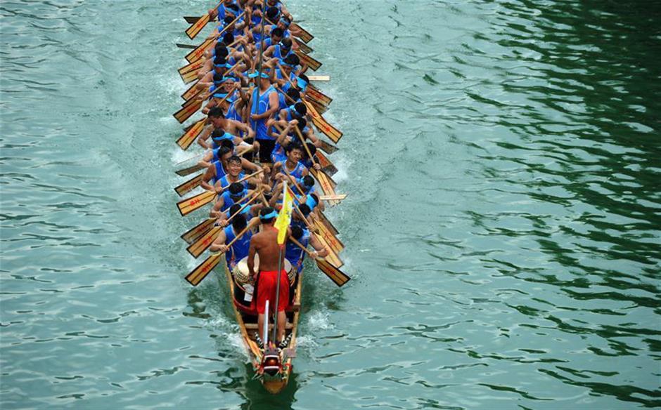 Training for dragon boat race held on Wuyang River in SW China