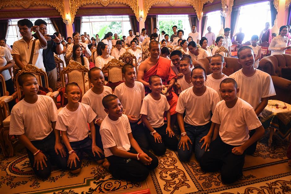 Thai teenage footballers return to school after cave saga