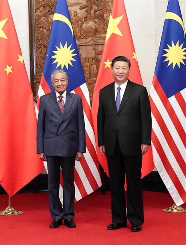 Xi meets Malaysian PM, calling for better ties in new era