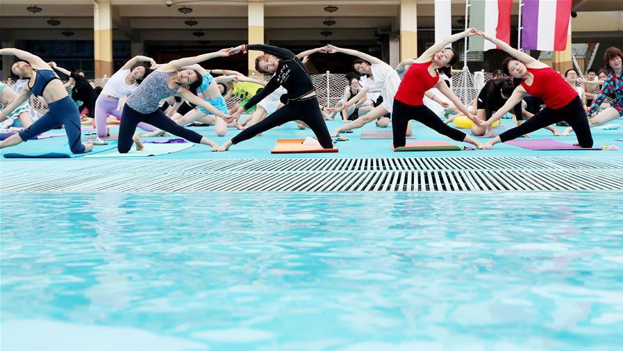 People practise yoga at park in Shanghai