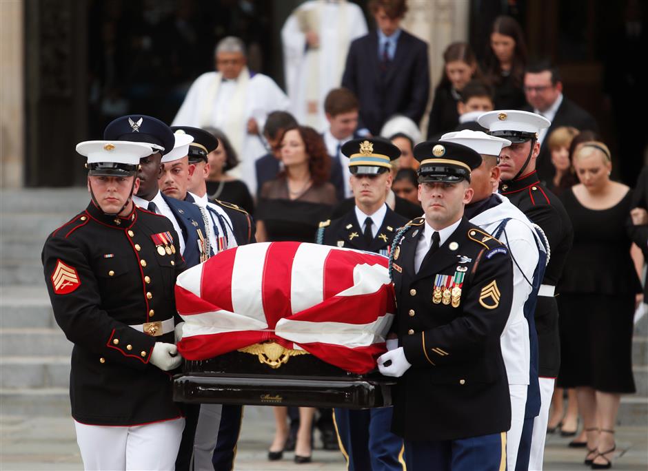 McCain honored at funeral by 2 ex-presidents, Trump plays golf