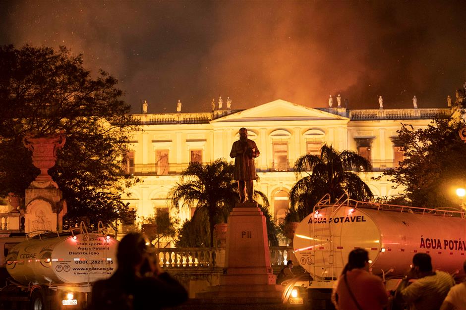 Priceless damage to artifacts as  fire tears through Rio museum