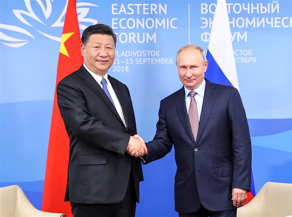 Xi, Putin vow to promote ties regardless of global changes