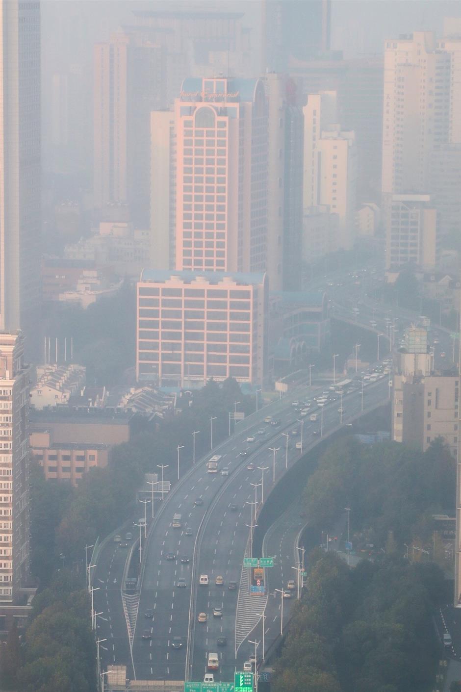 Vulnerable groups should stay inside as 'light smog' blankets Shanghai