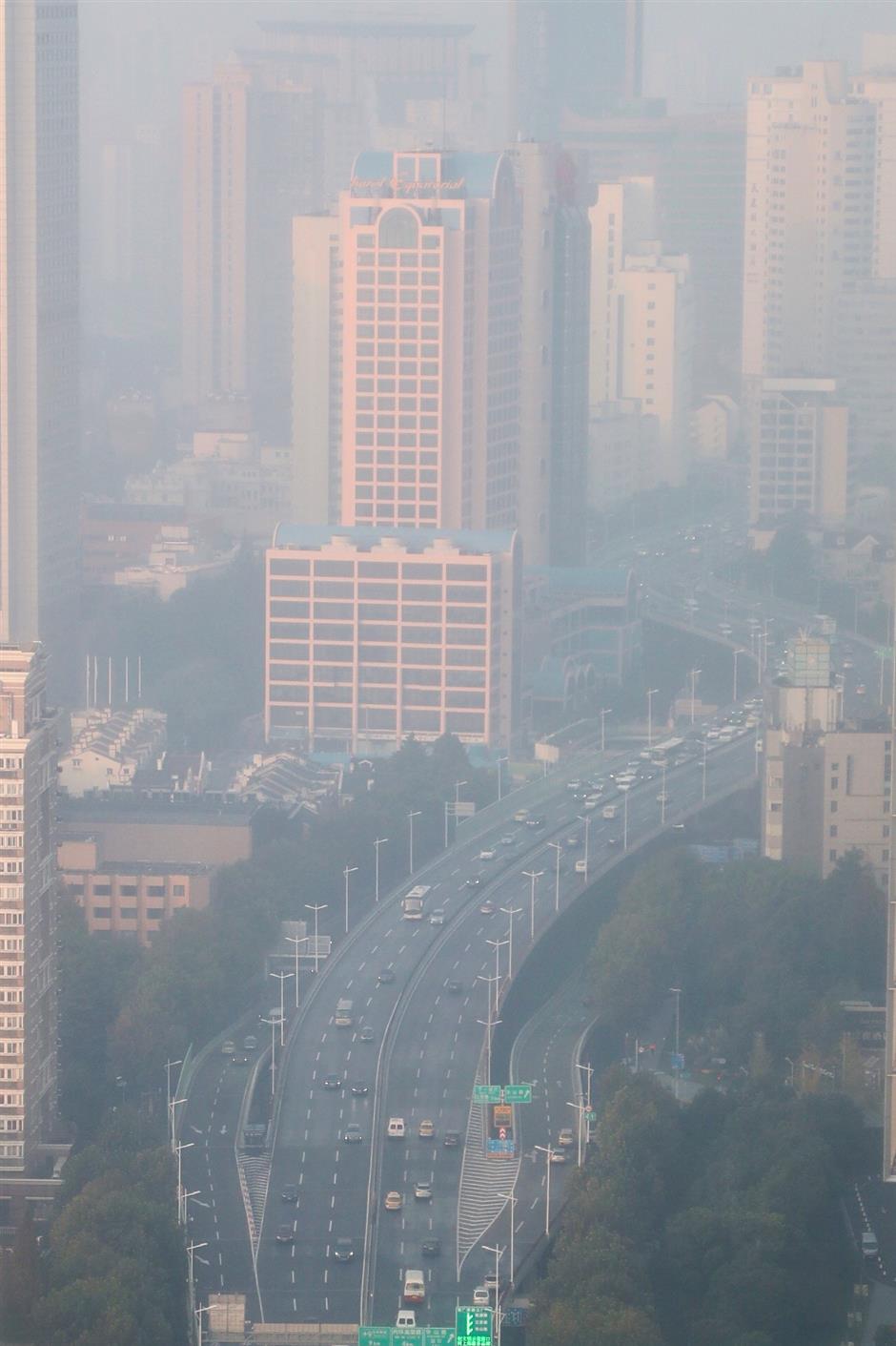 Vulnerable groups should stay inside as 'light smog' blankets Shanghai