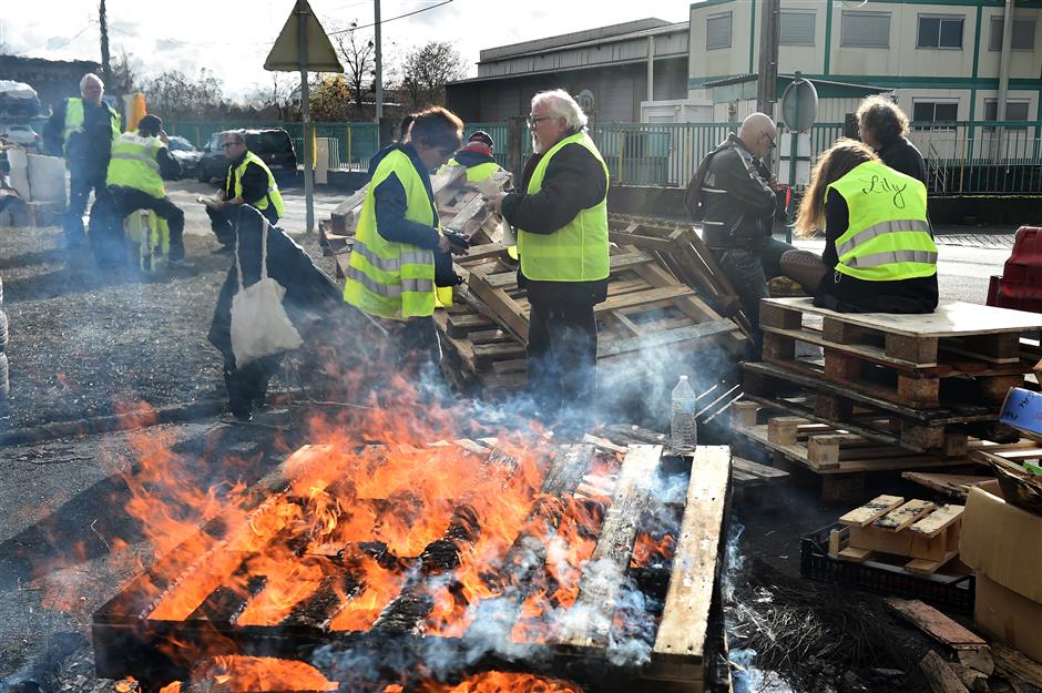 Haunted by 'Yellow Vests,' Macron seeks to get out of social uprising via risky moratorium